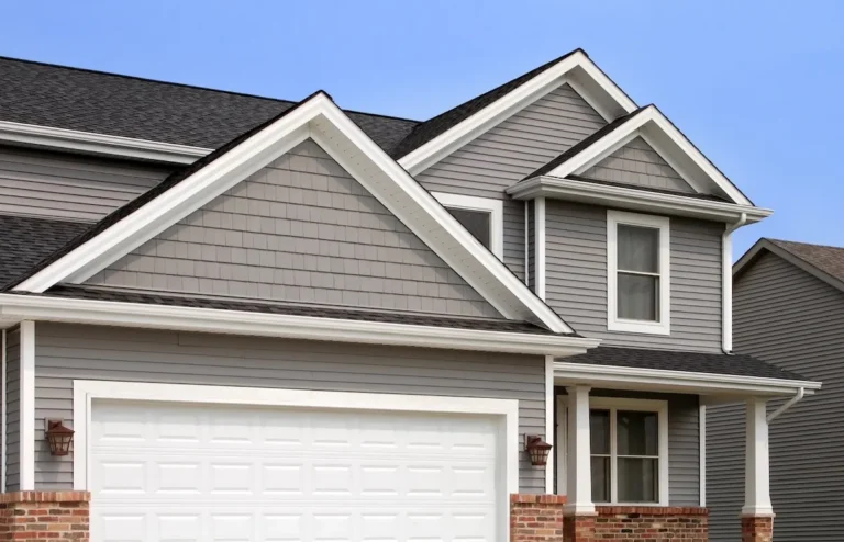 a-large-home-with-grey-siding