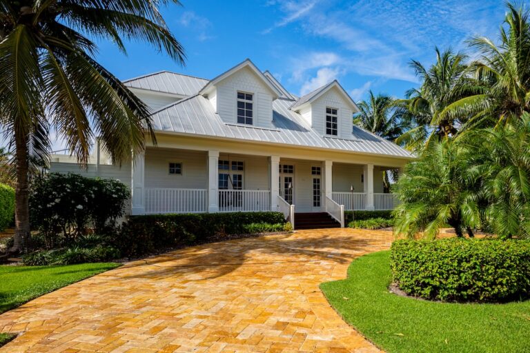 Naples, Florida USA - July 28, 2015: Beautiful wood frame architecture style home with new aluminum style roof in the coastal residential historic district of Naples.