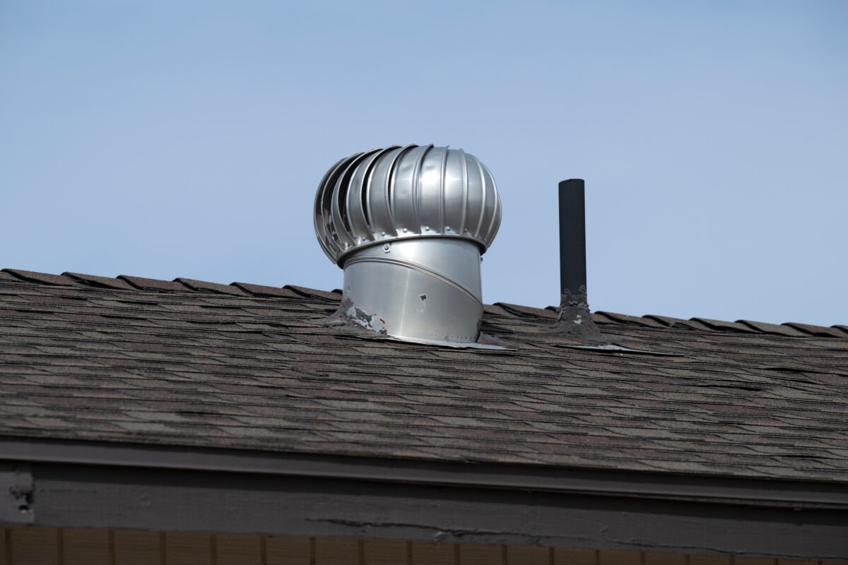 A metal vent on a house roof