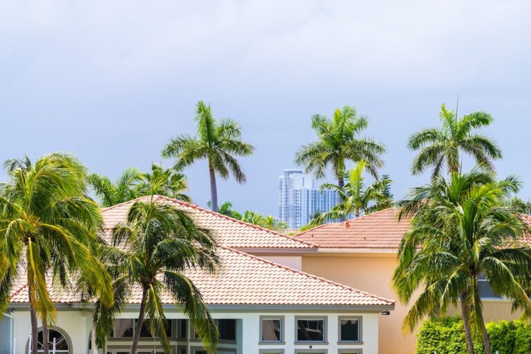 Miami, Florida real estate property modern mansion luxury villa house in Hollywood by Hallandale beach Three Islands with palm trees on summer day