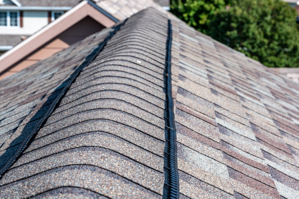 roof vent installation typical Ridge cap vent installed on a shingle roof for passive attic ventilation