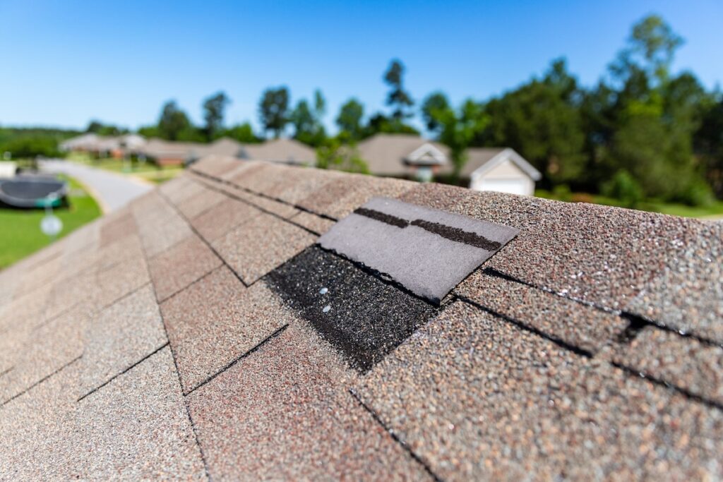 missing shingles Missing shingles on roof due to storm damage.